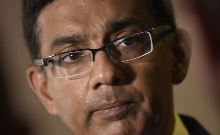 Dinesh D'Souza attends the premiere of his film <em>Death of a Nation</em> in Washington, D.C., in 2018. He donated $100,000 to the Patriot Freedom Project, an organization that is providing financial help to Jan. 6 defendants.