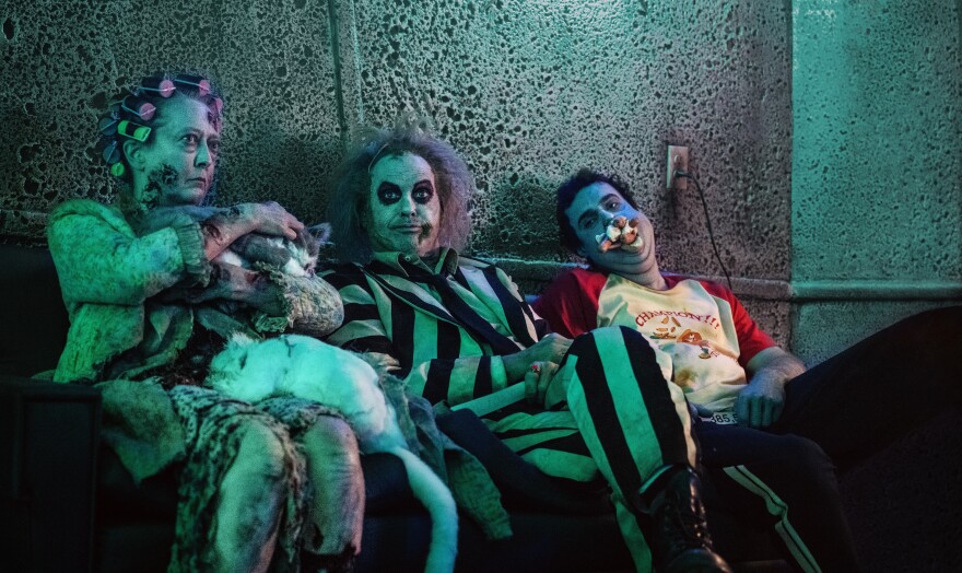 Michael Keaton (center) returns as the tricker ghost in "Beetlejuice Beetlejuice." (2024)