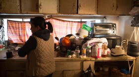 Farmworker Alma in the kitchen on the Fresno mobile home she shares with her husband and four children in this undated photo. 