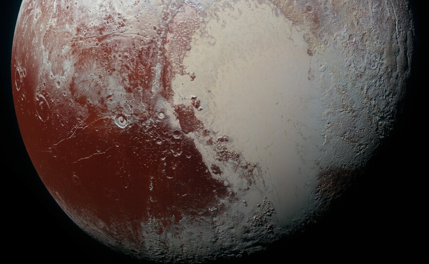 A high-resolution "false color" view of Pluto shows the dwarf planet's surface composition. New analysis shows that some of the bright red areas also include frozen water.