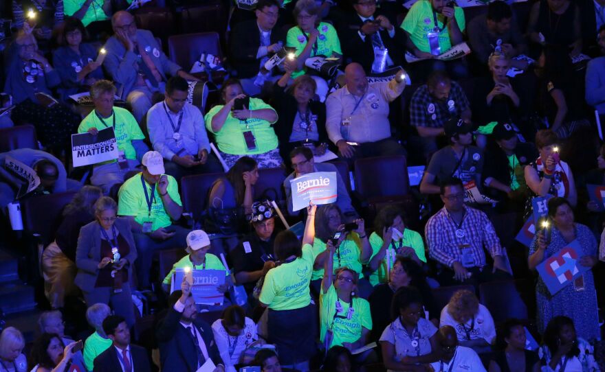 Bernie Sanders supporters wear bright shirts on the final day of the Democratic National Convention.