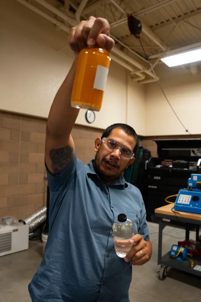 Rafael Serrano holds the brine (left) from which lithium (right) is extracted on Oct. 5, 2023.