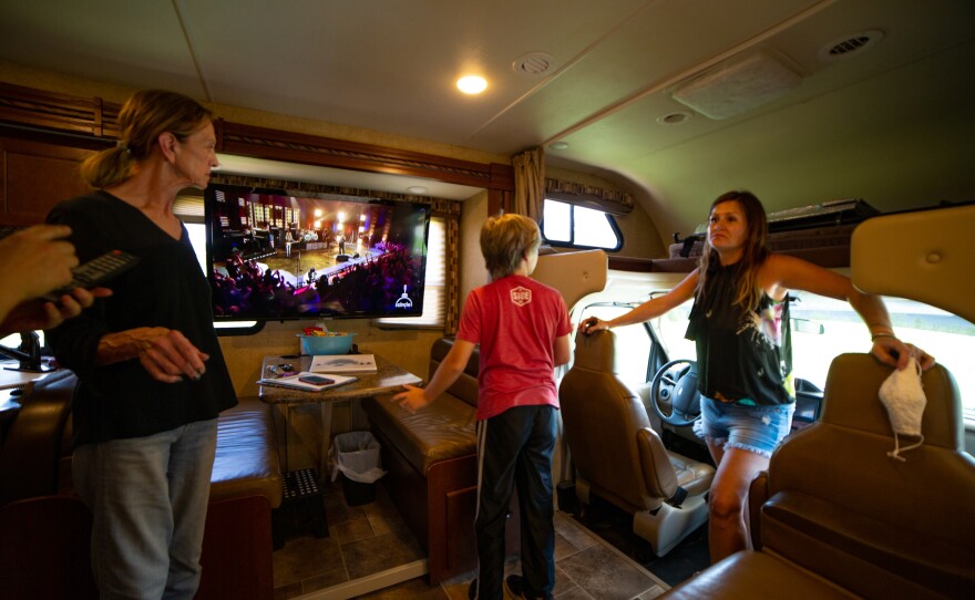 Amy Holditch receives a two-hour tour of the RV, with instructions for how to operate everything inside and out. From left: Sandra Gillis, Duncan Holditch, and Amy Holditch.
