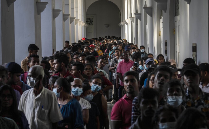 People throng President Gotabaya Rajapaksa's official residence on Tuesday, three days after it was stormed by anti government protesters in Colombo, Sri Lanka.