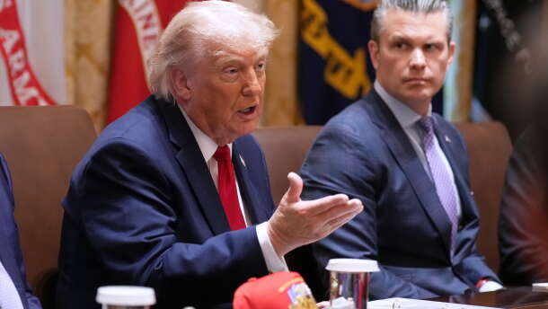 President Donald Trump speaks during a Cabinet meeting at the White House, Wednesday, May 27, 2026, in Washington, as Secretary of Defense Pete Hegseth, looks on.