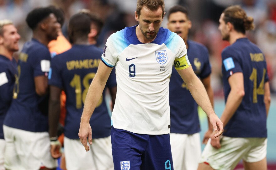 Harry Kane of England reacts after missing a penalty against Hugo Lloris of France during the World Cup quarterfinal match between England and France.