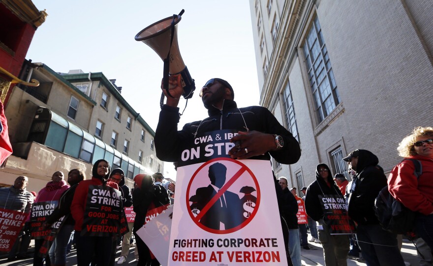 Verizon workers picket outside one of the company's facilities in Philadelphia Wednesday. Verizon landline and cable workers on the East Coast walked off the job Wednesday morning after little progress in negotiations since their contract expired nearly eight months ago.