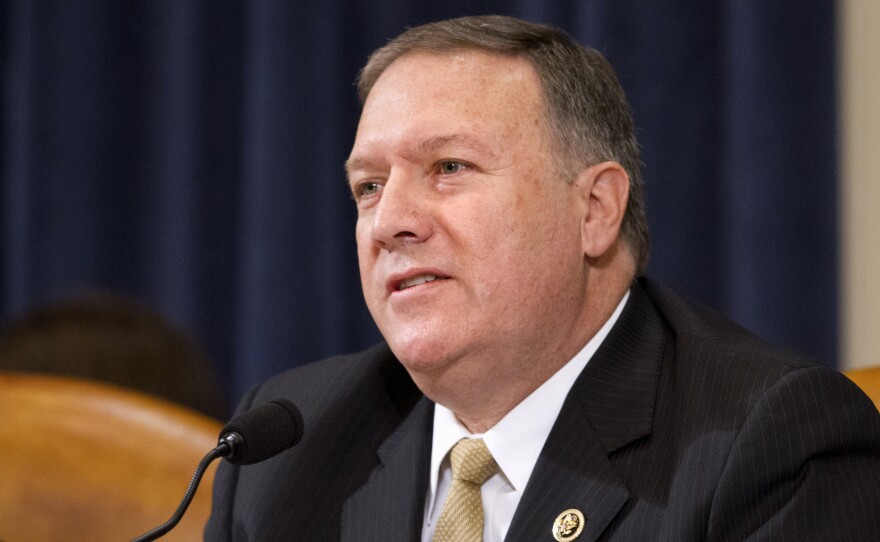 House Committee on Benghazi member Rep. Mike Pompeo, R-Kan., questions then-Democratic presidential candidate Hillary Clinton, during a hearing in October 2015.