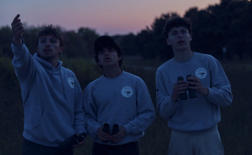 Trojan (left), Pacetti and Train look for a nighthawk at Edwin B. Forsythe National Wildlife Refuge after the sun set.
