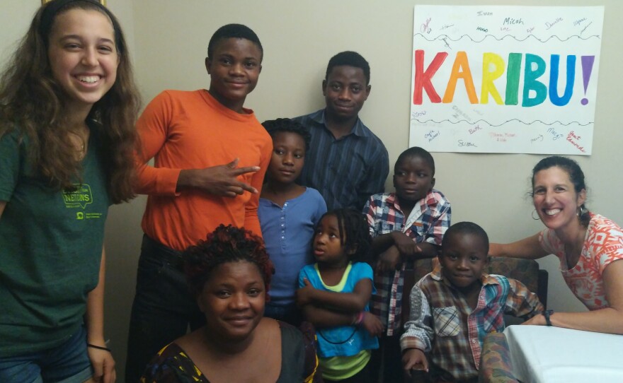 American volunteers Lilah Katz (far left) and her mother, Sharon Fine (far right), welcomed (top row from left) Fikiri, Onike, Paluki and Bienvenie, and (bottom row from left) Cecil, Oliva and Jeteme.