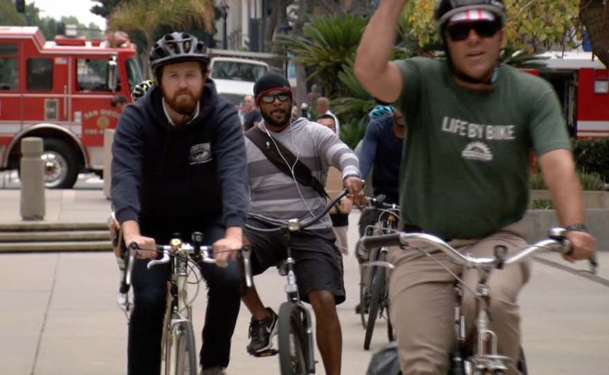 Cyclists ride through downtown San Diego in a rally before a City Council vote on the Downtown Mobility Plan, June 21, 2016.