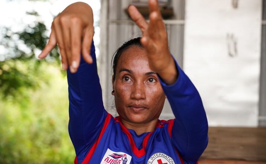 Sinet An, who was born with a disability, is the star of Cambodia's women's wheelchair basketball team, which celebrated their first win in an international tournament just before the pandemic hit. With Cambodia in lockdown, she hones her skills in virtual practice sessions from her home in Chuuok village in Kandal province. Above: a practice session on June 24.
