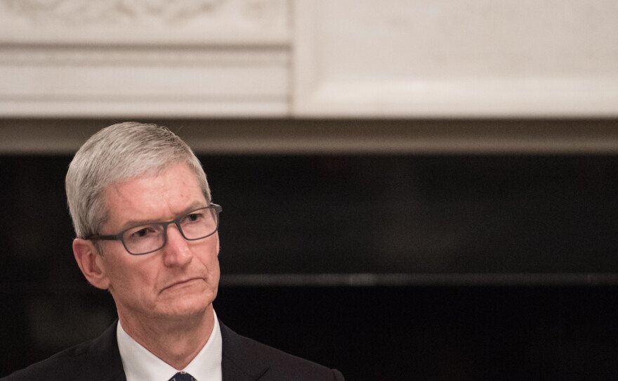 Apple CEO Tim Cook listens to a speaker during an American Technology Council roundtable at the White House on June 19. Cook is speaking out against the decision to end the DACA program, which affects more than 250 Apple employees.