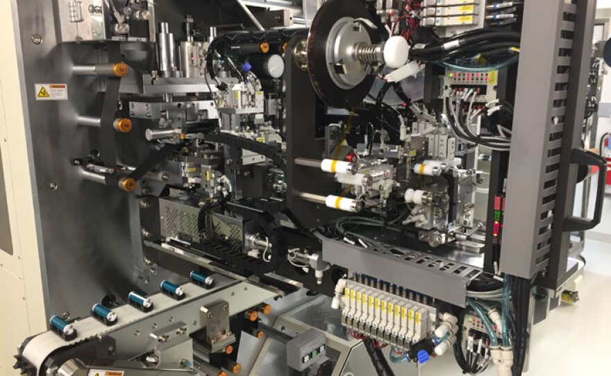 This Rube-Goldberg-like machine at the University of Michigan Energy Institute fabricates lithium ion batteries.