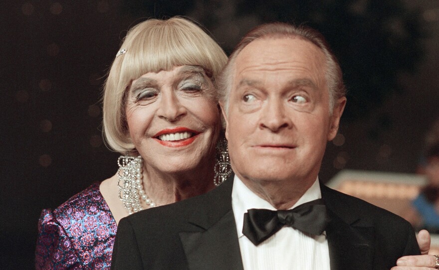 Milton Berle, in drag, performs a skit with Bob Hope during taping of the <em>Bob Hope Buys NBC</em> special at NBC Studios in Burbank, Calif., in 1985.