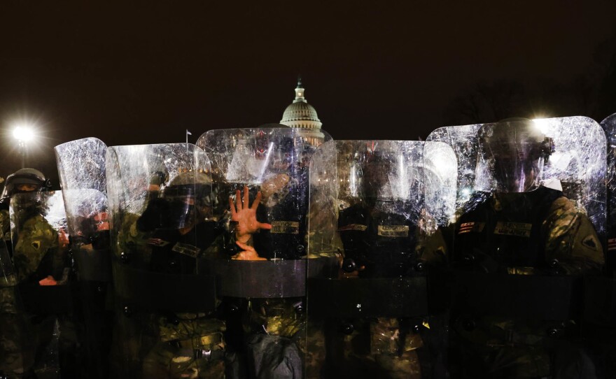 Members of the National Guard and the Washington D.C. police keep a group of demonstrators away from the U.S. Capitol on Jan. 6, 2021 in Washington, D.C.