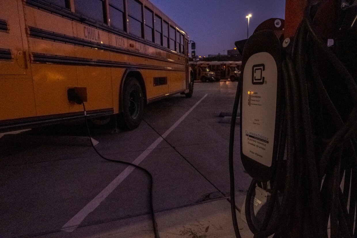 An electric powered school bus is plugged in for recharge at the Chula Vista Elementary School District's bus yard in Chula Vista, California on Oct. 12, 2021.