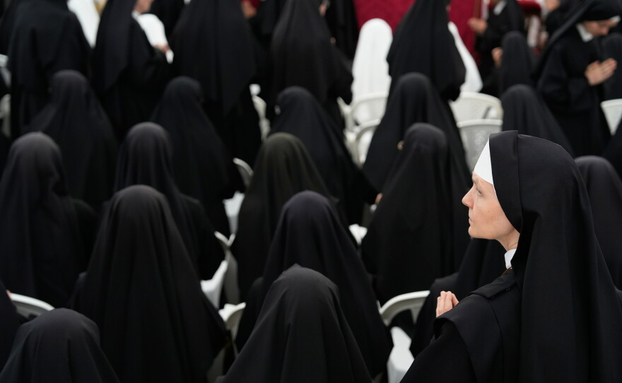Nuns attend a consecration ceremony for four new bishops in a tent set up outside the Society of St. Pius X seminary, in Econe, Switzerland, Wednesday, July 1, 2026.