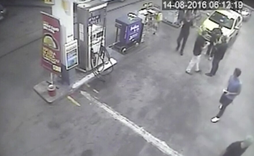 In this surveillance video frame released by Brazilian police, swimmers from the U.S. Olympic team appear with Ryan Lochte (right) at a gas station last weekend. A top Brazil police official said the swimmers damaged property at the gas station.