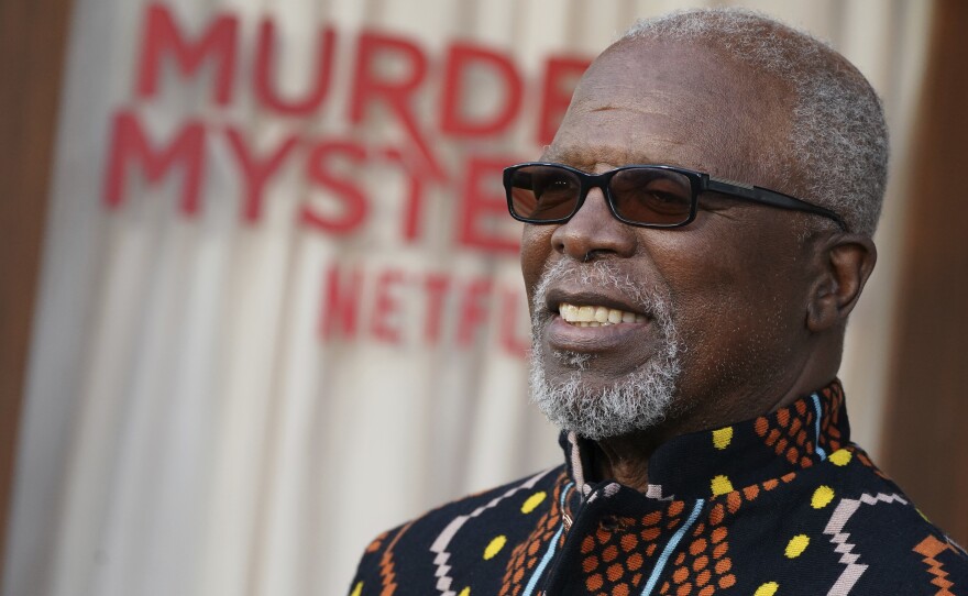 John Kani arrives at the premiere of "Murder Mystery 2" on Tuesday, March 28, 2023, at the Regency Village Theatre in Los Angeles.