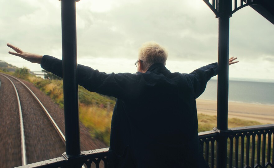 Alan Cumming on the back of the train.