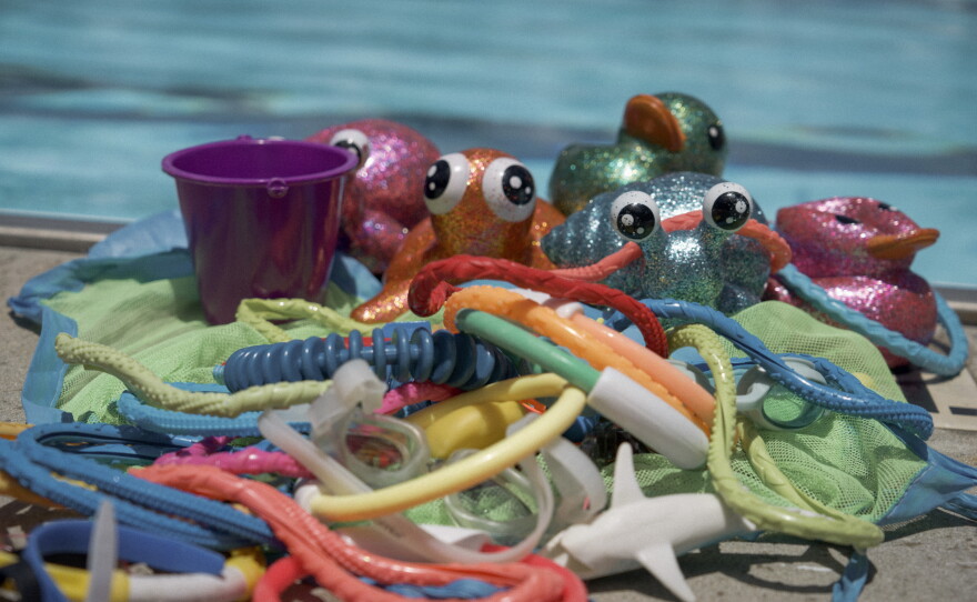 A selection of colorful, sparkly toys are often used for positive reinforcement and redirection in Swim Buddies lessons.