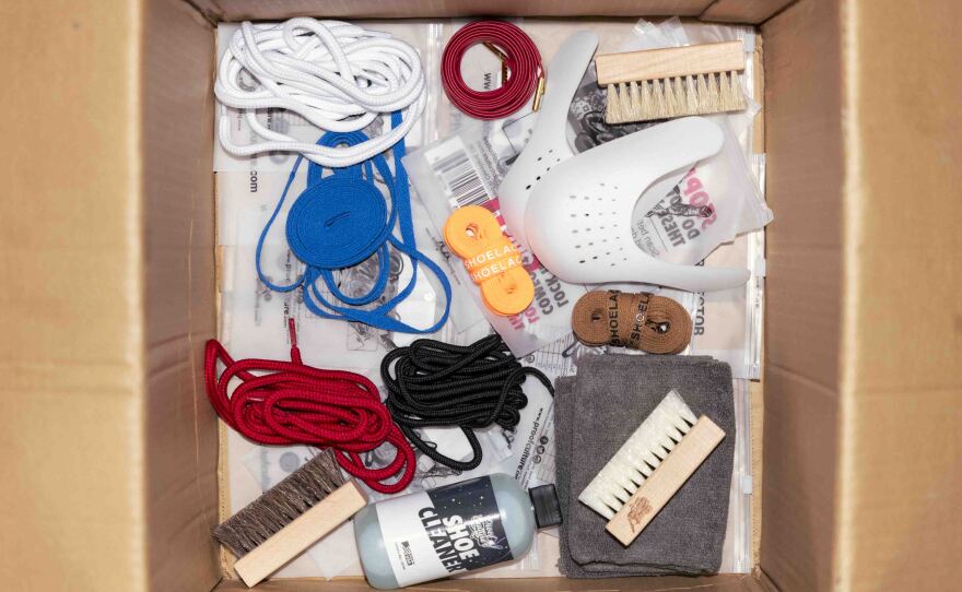 A box of selected Proof Culture products sneakers is packed before it is shipped to a customer.