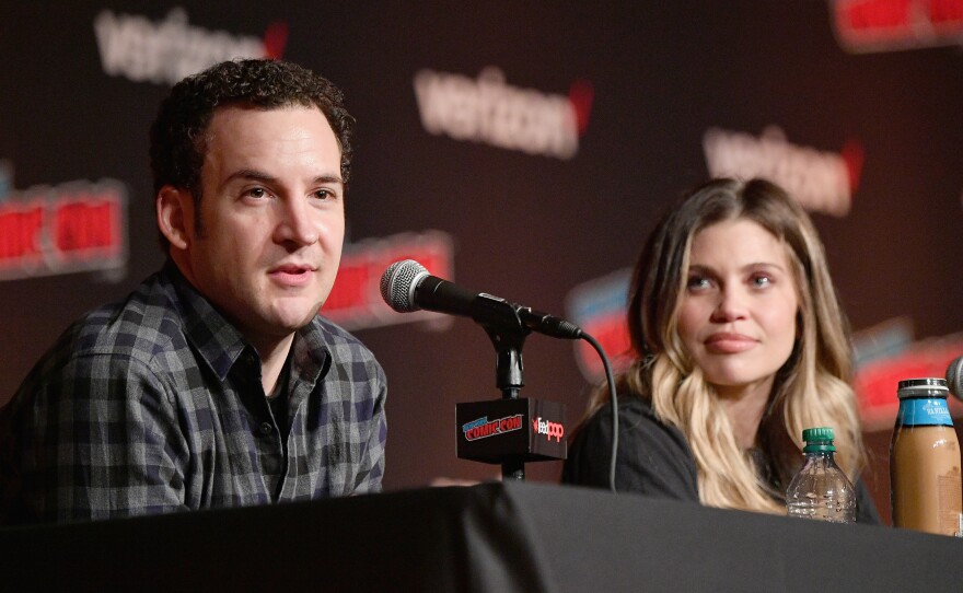 Ben Savage (left) and Danielle Fishel speak onstage at the Boy Meets World 25th Anniversary Reunion panel during New York Comic Con 2018. Savage announced this week he is running for Congress.