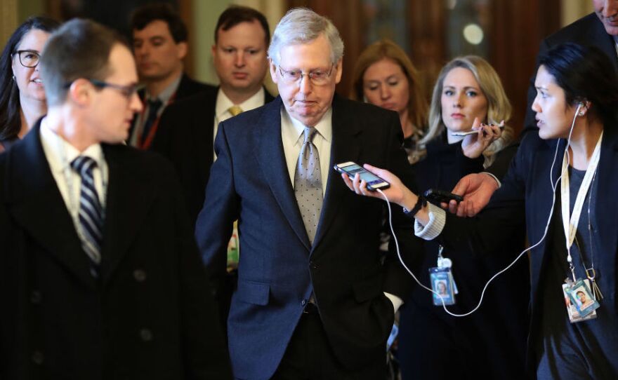 Senate Majority Leader Mitch McConnell, R-Ky., is trailed by reporters after speaking on the Senate floor on Tuesday.