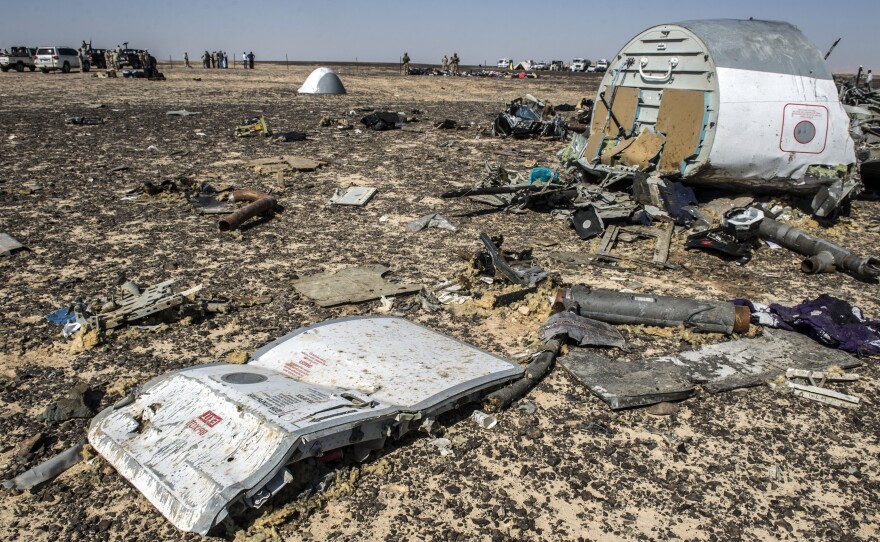 Debris from a Russian airliner is at the site of the crash in a mountainous area in Egypt's Sinai Peninsula. Citing new information, Britain's government says it is concerned that a bomb might have brought the plane down.