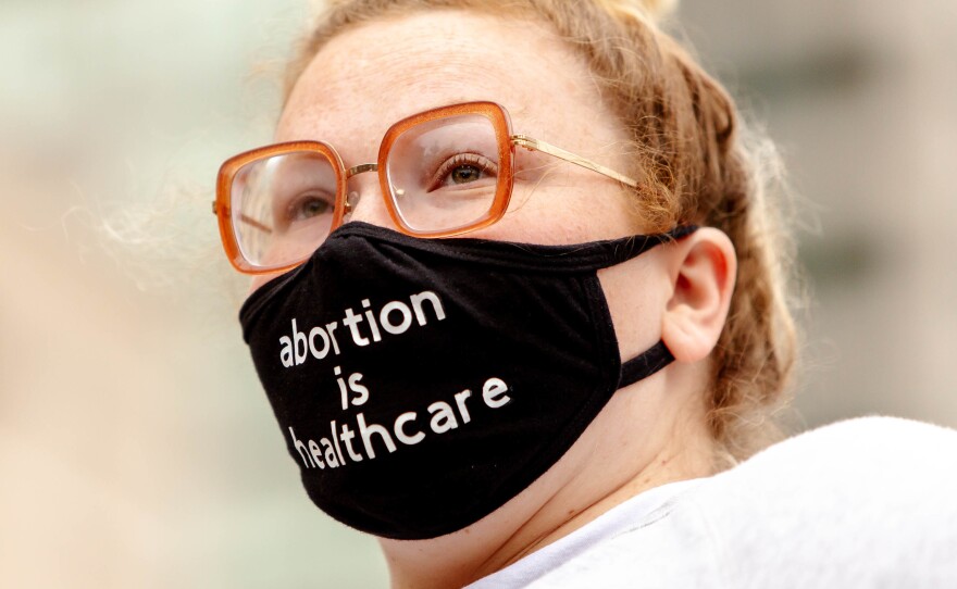 <strong>ST. LOUIS:</strong> Erin Barry, 28, of Maplewood, looks out to a crowd advocating for abortion rights on Tuesday at the Thomas F. Eagleton U.S. Courthouse in downtown St. Louis.