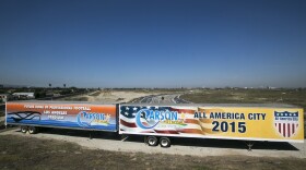Carson City officials unveil a banner reading "Future Home of Professional Football Los Angeles Stadium'' near the Interstate 405 and Del Amo Blvd., in Carson, Aug. 28, 2015. 