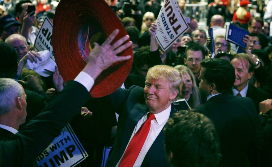 Donald Trump is given a sombrero at a raucous rally of thousands in Las Vegas.