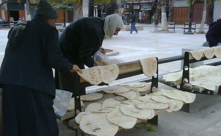 Freshly baked bread is spread out on any available surface while it cools, a morning ritual in Aleppo, Syria. The northern Syrian town is making a name for itself as a tourist destination for food lovers.