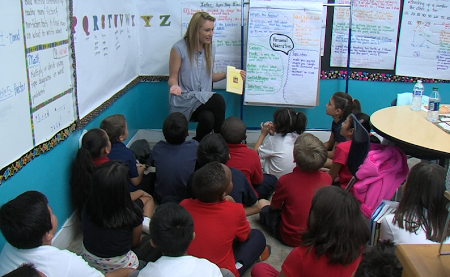 America's Finest Charter School teacher Cassandra Tinyo prepares to read a story to her third-grade class on Nov. 2, 2015.