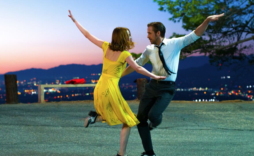 Emma Stone and Ryan Gosling dance in the musical, <em>La La Land, </em>critic David Edelstein's pick for the best film of the year.