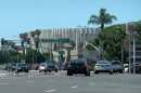 Cars drive along a street in the Midway District with the Valley View Casino Center in the background, Aug. 29, 2018.