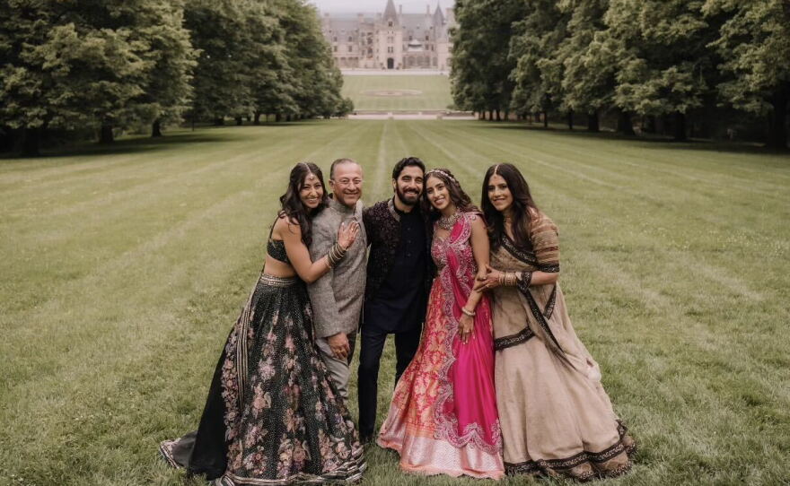 From left, Ashna Ahuja, Deepak Ahuja, Akash Mahtani, Shreya Ahuja and Madhu Ahuja attended Mahtani and Shreya Ahuja's wedding in Asheville, N.C., in 2025.