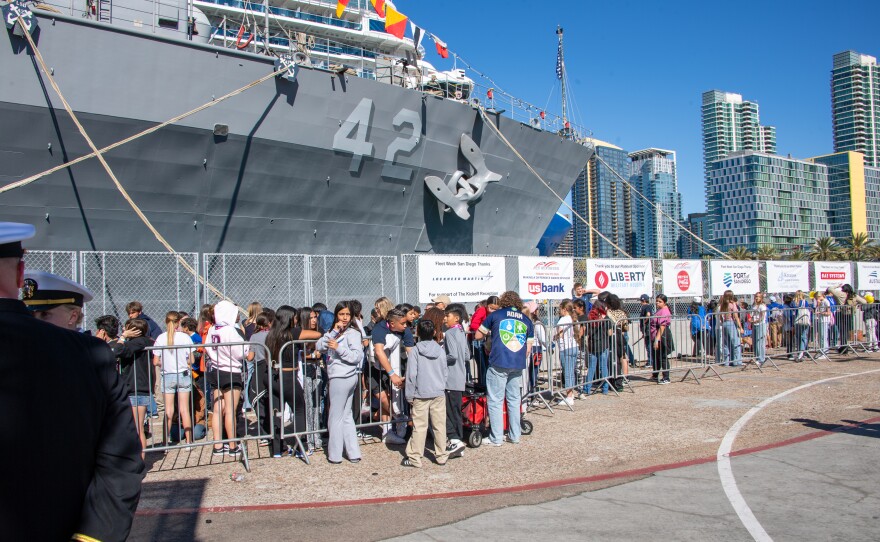 Students wait in line for a tour of amphibious dock landing ship USS Germantown (LSD 42) on Broadway Pier during Fleet Week San Diego in San Diego, Nov. 7, 2024.