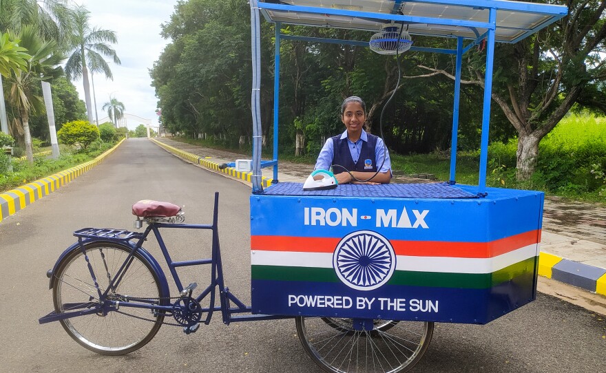 Vinisha Umashankar and her solar ironing cart. She came up with the idea when she was 12 — then worked with engineers to create a prototype. Now she's in Glasgow, Scotland, to speak at the COP26 climate change conference.
