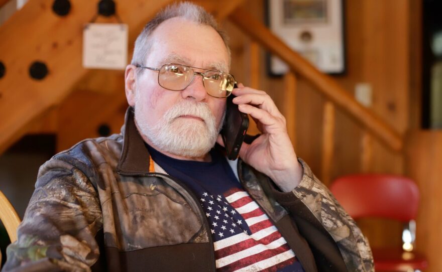 Ron Johnson in his log house in Butte, Alaska.