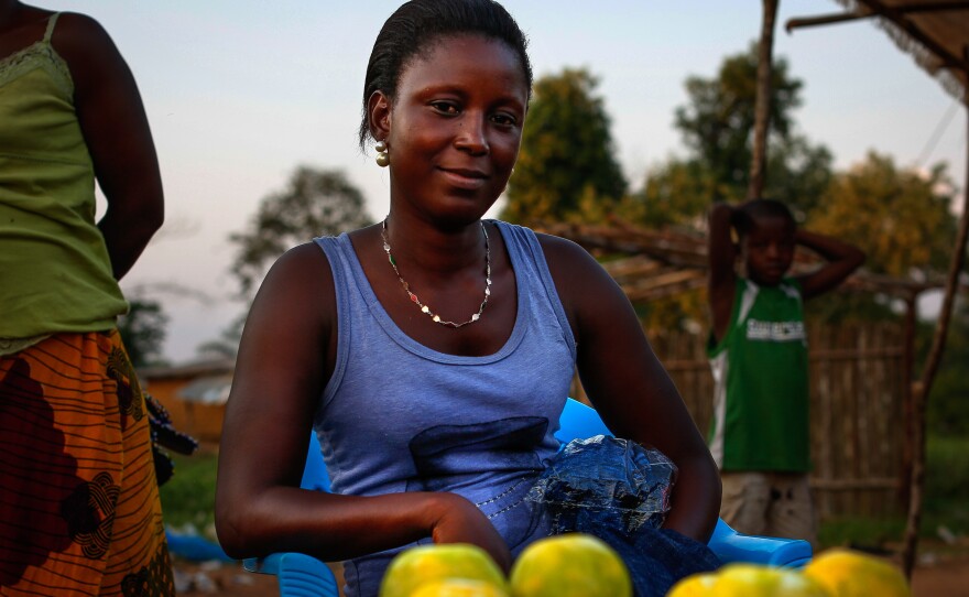 Just off of Ganta's main street, 18-year-old ready-peeled orange seller Bebe Gono says she's struggling. "We are trying to find the little we can afford," she says.