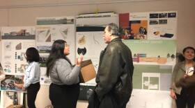 Former Paradise resident Patrick Cole talks with a Cal Poly student about her redesign concept in this undated photo. 