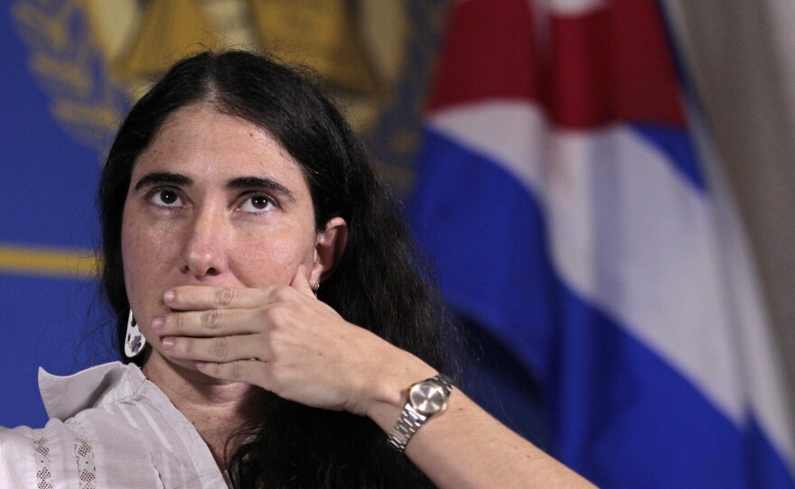 Yoani Sanchez, internationally known dissident blogger from Cuba, listens to a question as she speaks at the Freedom Tower in Miami on Monday.