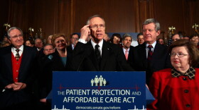 Senate Majority Leader Harry Reid (D-NV) speaks at a rally of Democratic senators following a final series of procedural votes on the health bill Wednesday.
