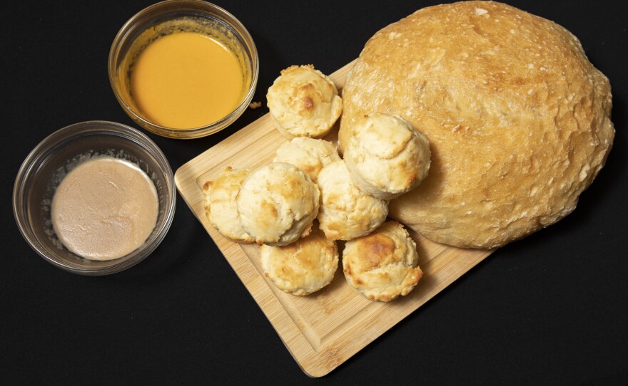 Homemade bread and rolls are paired with baby food, a cheaper alternative to butter.