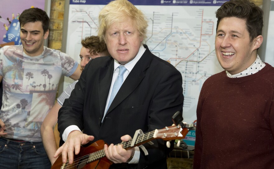 London Mayor Boris Johnson plays a guitar at an event to promote street performances in the city in March 2015. Johnson has broken ranks with Prime Minister David Cameron, a fellow Conservative Party member, by calling for Britain to leave the European Union.
