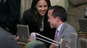 Assemblywoman Autumn Burke, D-Inglewood, talks with Assemblyman David Chiu, D-San Francisco, after their measure regulating pregnancy centers was approved by the Assembly in Sacramento, Calif., Tuesday May 26, 2015.