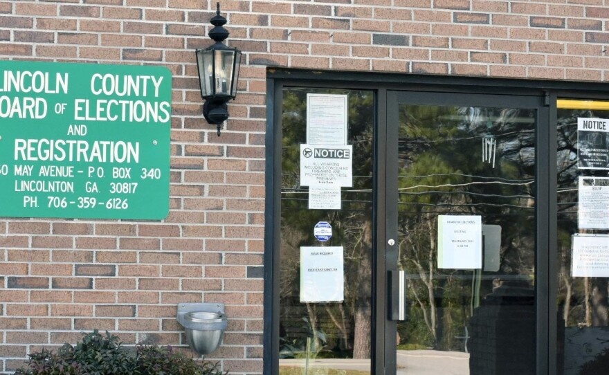 The rural Lincoln County Board of Elections has postponed a vote to consolidate its seven polling places into a single site after voting rights groups delivered a petition to temporarily halt the plan, calling it voter suppression. Local elections officials say they lack appropriate resources to keep every poll available.