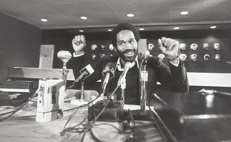 O.J. Simpson at a press conference in 1975; a new ESPN documentary series charts his rise and fall.